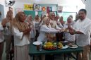 Perayaan HUT ke-18 PIRA (Perempuan Indonesia Raya) yang diselenggarakan di Jalan Raya Tanah Baru, Kecamatan Beji. (Sumber foto: Istimewa)